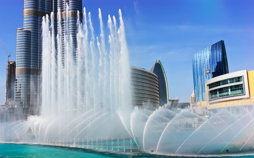 DUBAI, UAE - NOVEMBER 14: The Dancing fountains downtown and in a man-made lake in Dubai, UAE on November 14, 2012. The Dubai Dancing fountains are world's largest fountains with height 150 m. &copy; Laborant / Shutterstock.com